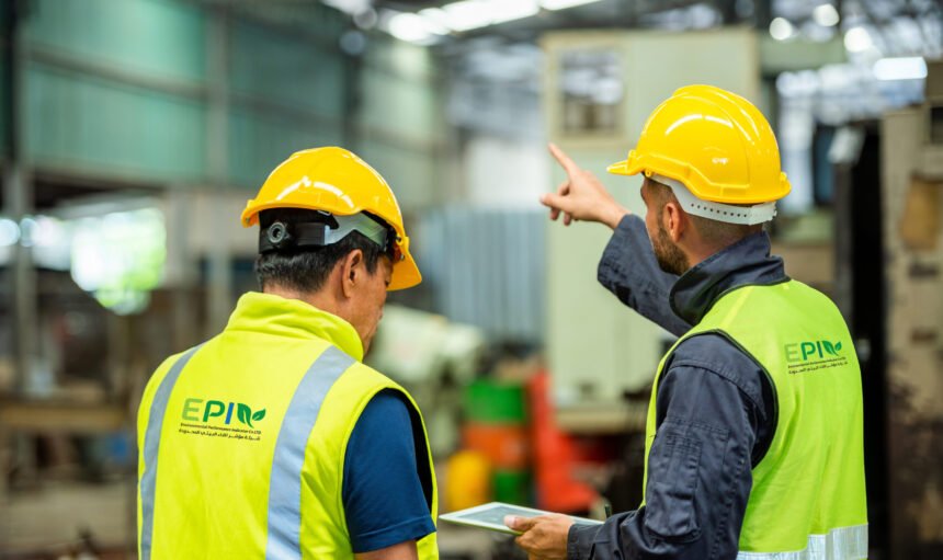 Two professional engineer worker technician assistant in helmet inspection check old machine construction factory with colleague manager. check old machinery production construction operating