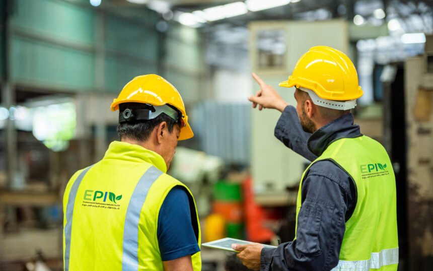 Two professional engineer worker technician assistant in helmet inspection check old machine construction factory with colleague manager. check old machinery production construction operating